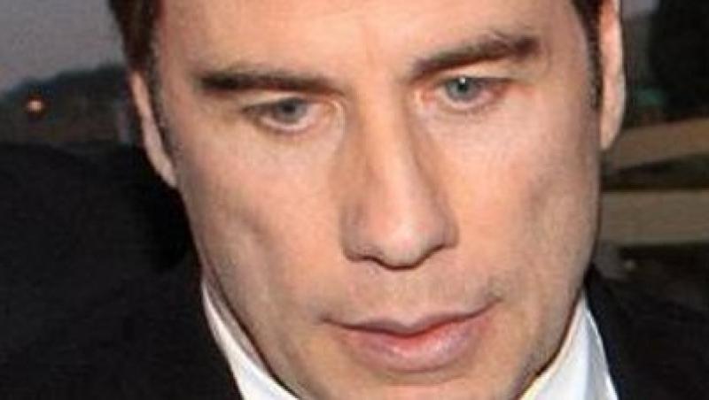 John Travolta s-a tuns periuta