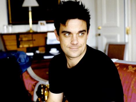 Robbie Williams vrea sa adopte doi copii din Haiti