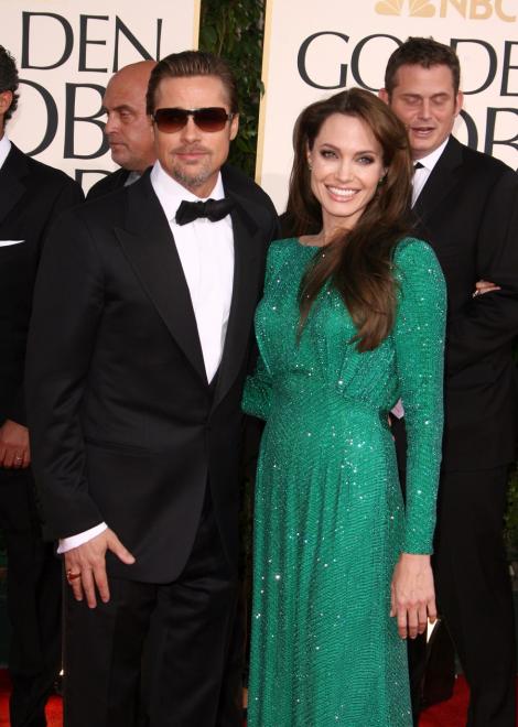 Angelina Jolie si Brad Pitt vor sa infieze un copil din Romania!