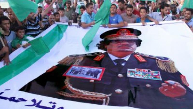 Muammar Gaddafi,  inmormantat intr-un loc secret din desert