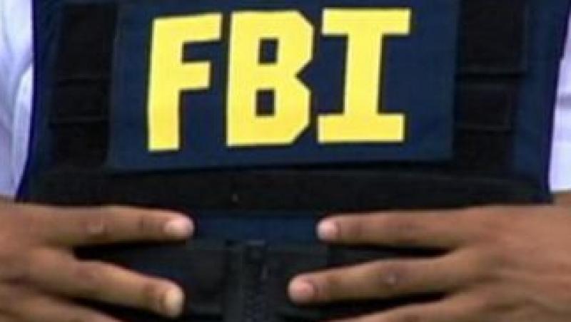 Dosarul a 14 romani acuzati de frauda si furt de identitate, prezentat de FBI