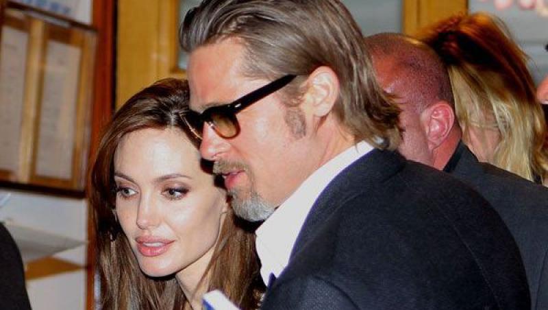 FOTO! Brad Pitt si-a lasat parul lung!