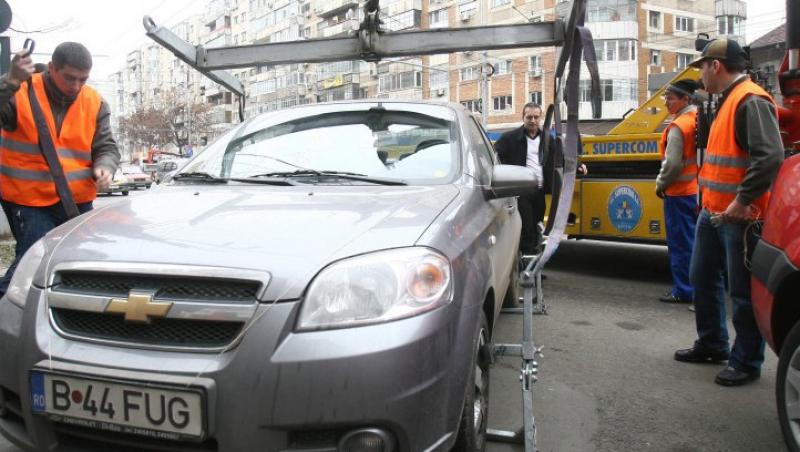40% reducere la tarifele pentru ridicarea masinilor parcate ilegal