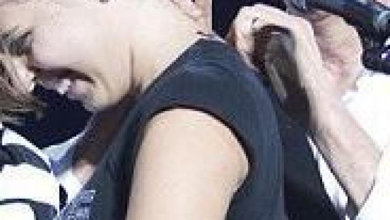 O fana de-a lui Paul McCartney si-a tatuat semnatura artistului pe ceafa