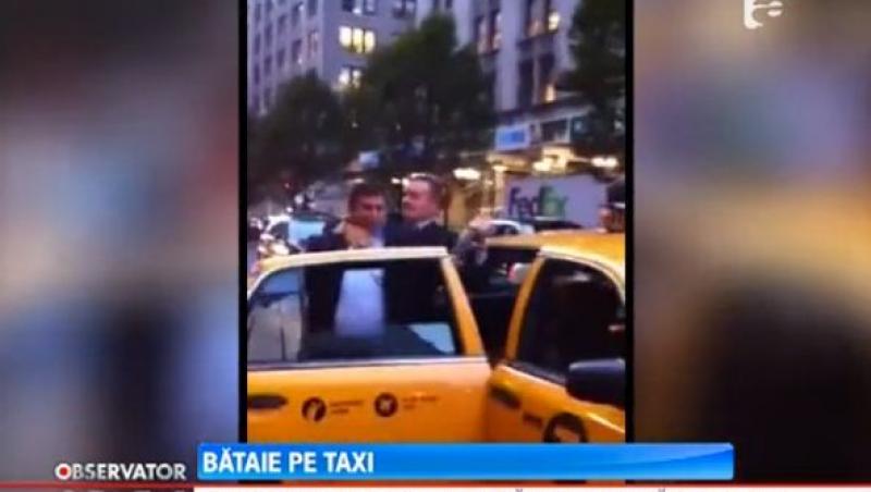 VIDEO! Doi oameni de afaceri din New York s-au batut pentru un taxi ca doi adolescenti infierbantati!