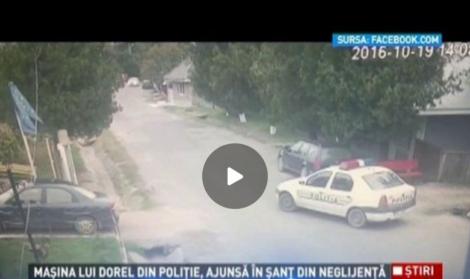 Video de tot râsul! Celebrul "DOREL" există şi în instituţii importante. O maşină a Poliţiei Române ajunge în şanţ  după ce este lăsată fără frâna de mână trasă