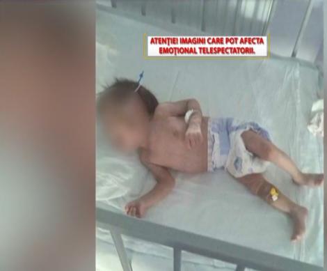 Simona Gherghe, cu lacrimi în ochi, în direct! Un bebeluş de nouă luni a fost lăsat să moară de foame, în spital. Este atât de slab, încât alunecă printre gratiile pătuțului
