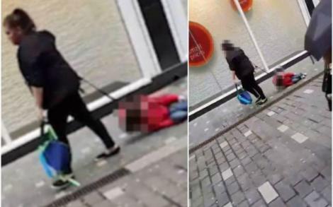 Imagini şocante. Video-ul cu o mamă care îşi târăşte copilul pe stradă face înconjurul lumii. Ce explicaţie a dat femeia
