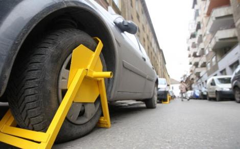 Coșmarul șoferilor din Capitală revine! Roțile mașinilor parcate neregulamentar vor fi blocate din 2019. Cât costă deblocarea