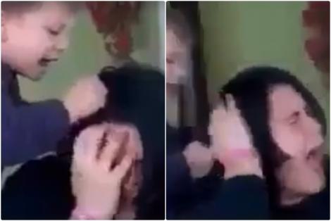 VIDEO / Un copil de cinci ani își lovește mama în cap și o trage de păr, în timp ce o altă rudă filmează. Băiatul urlă cât îl țin plămânii