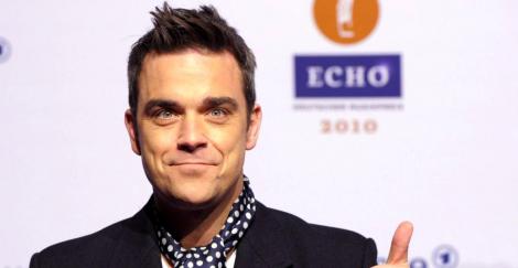 Robbie Williams a comis-o din nou! Cum a reușit să își enerveze la culme fanii: “Ești dezgustător și lipsit de respect!”