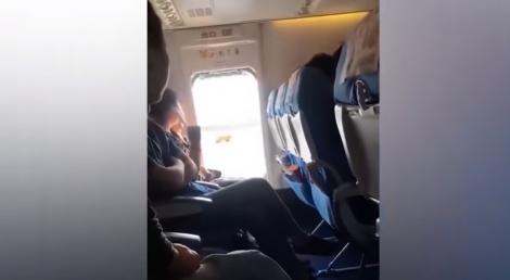 O femeie a deschis ieșirea de urgență într-un avion în timpul zborului pentru a lua „aer curat”! Avionul a avut întărziere de o oră din această cauză - VIDEO