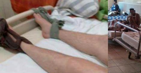 Legat de pat și sedat în spitalul care trebuia să-l trateze: "La externare avea răni din cauza pamperșilor neschimbați"