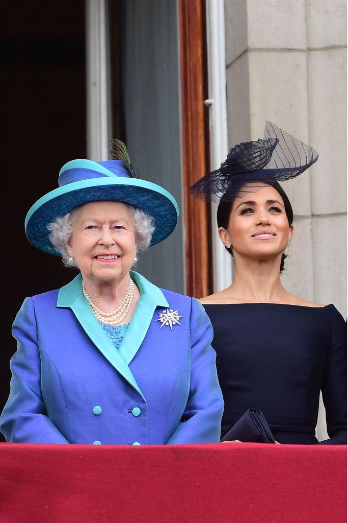 regina elisabeta si meghan markle