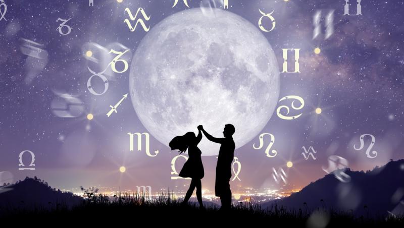 imagine cu un cuplu si cele 12 simboluri pentru zodii asezate in cerc