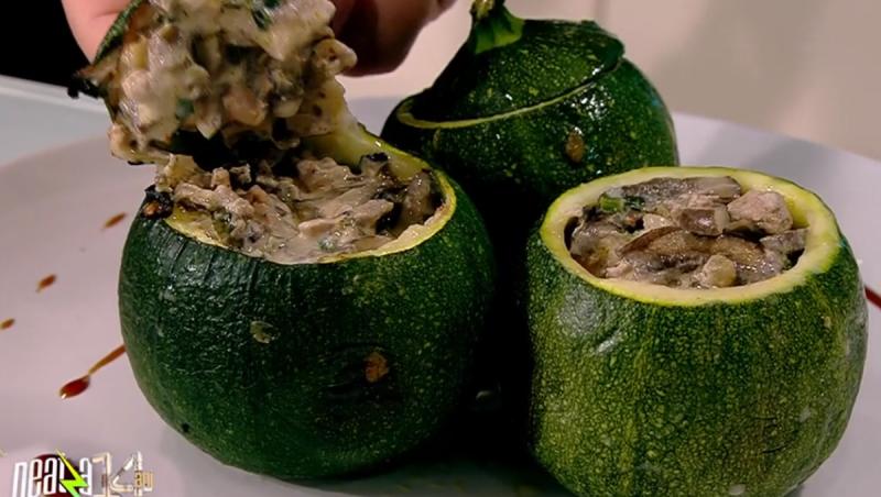 Three round zucchini stuffed with mushrooms and turkey meat on a plate