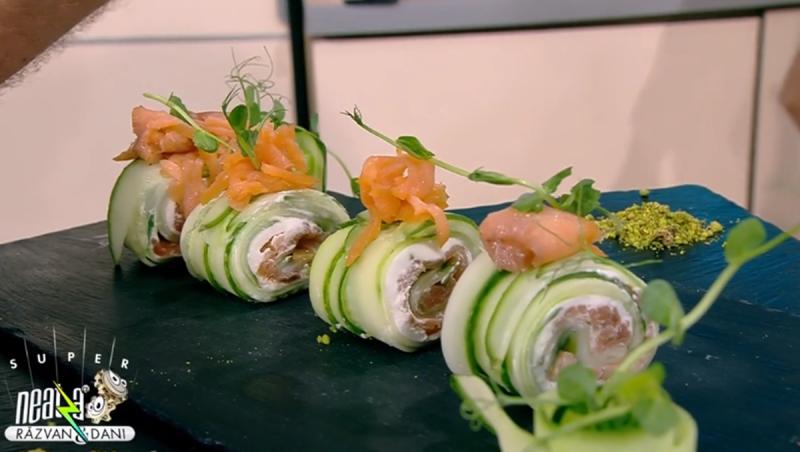 Cucumber sushi side with smoked salmon and black plate