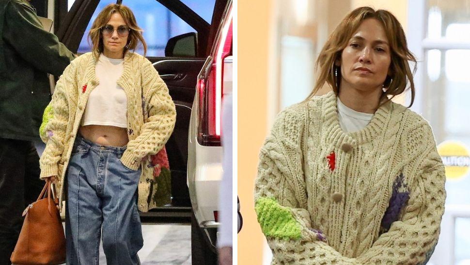 jennifer lopez in blugi tricou si pulover surprinsa intr-o parcare de paparazzi