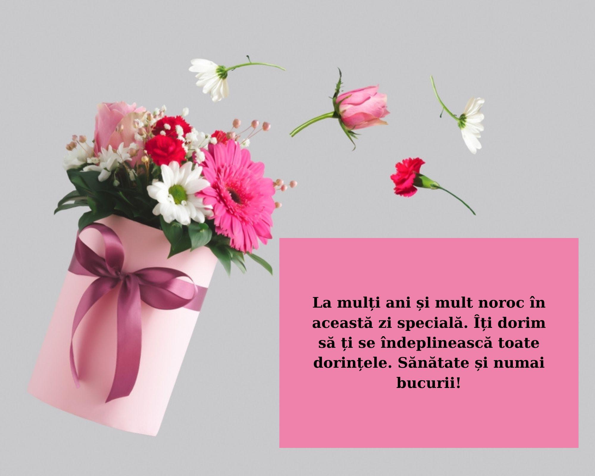 felicitare cu buchet de flori si chenar roz in care e urare de la multi ani