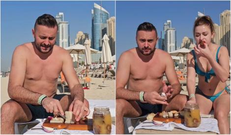 Cum s-au filmat doi români pe plajă în Dubai. Au mâncat slănină cu ceapă și au stins totul cu palincă | VIDEO