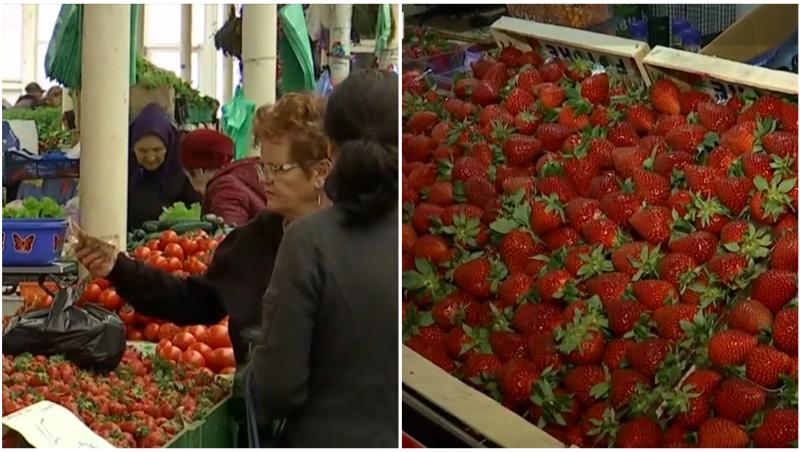 Două femei la tarabă care vor să cumpere căpșune