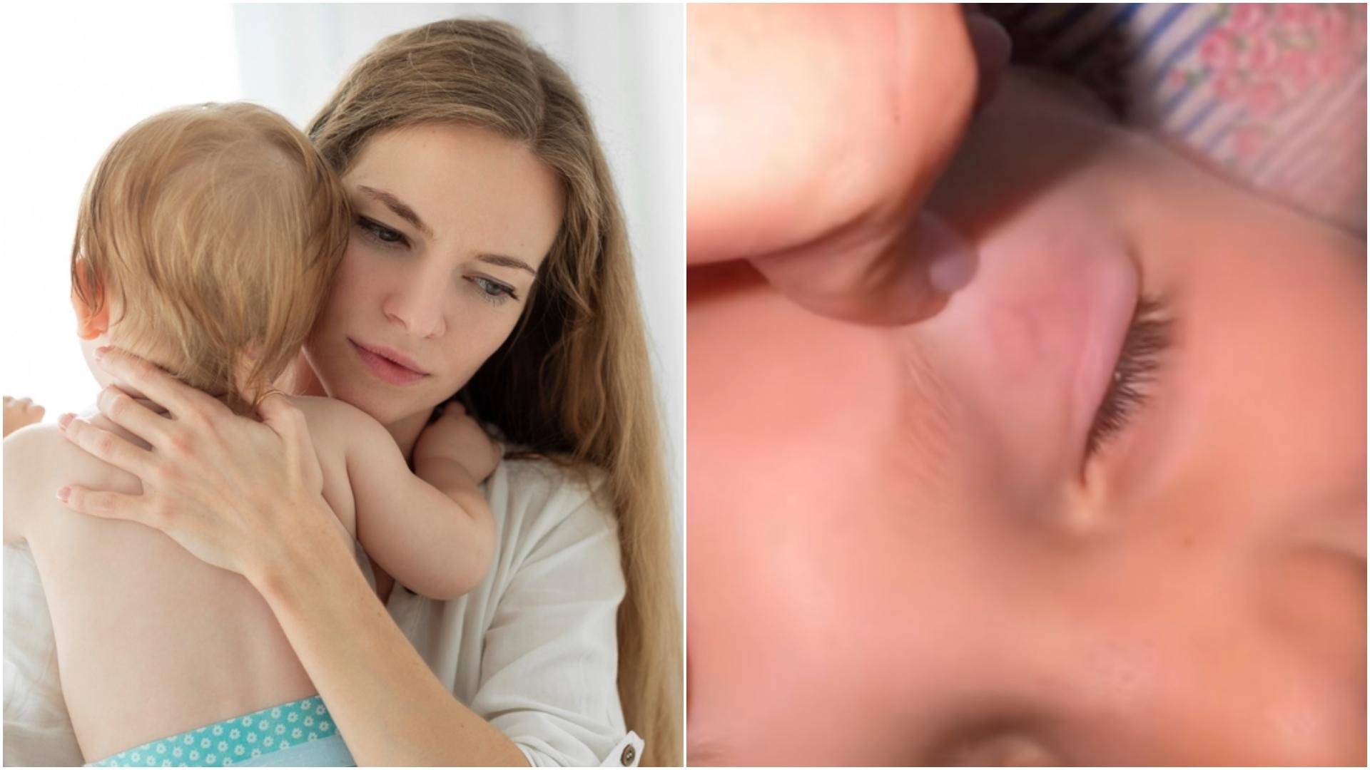 imagine cu o mama care isi tine bebelusul in brate