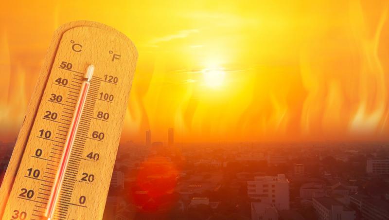 imagine cu un oras incins de caldura si un termometru care indica temeraturi mari