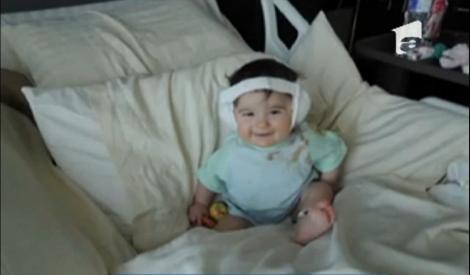 Un copil de nouă luni, printre primii oameni cu o ureche bionică