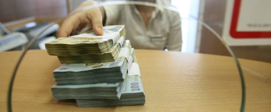 Îți ții banii la bancă pentru a câștiga dobândă?! S-ar putea să ieși în pierdere! Ce se întâmplă cu banii românilor la 18 bănci din 23