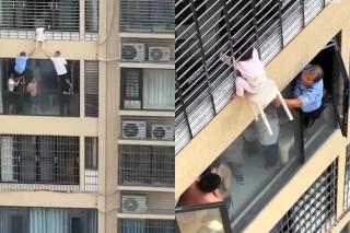 Momente dramatice în China! O fetiță a rămas suspendată la etajul 12. Gestul disperat al vecinilor care i-au salvat viața | VIDEO