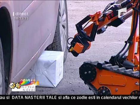 Robotelul neutraliza coletul si masina lui Razvan
