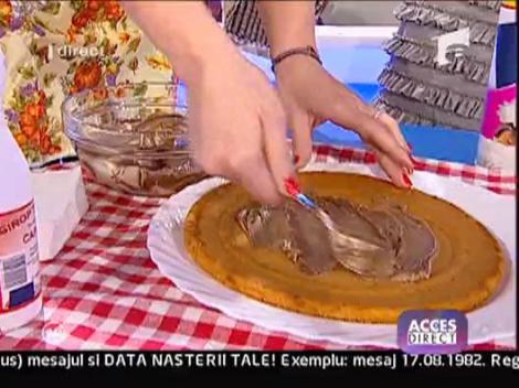 Gina Pistol orneaza un tort in direct