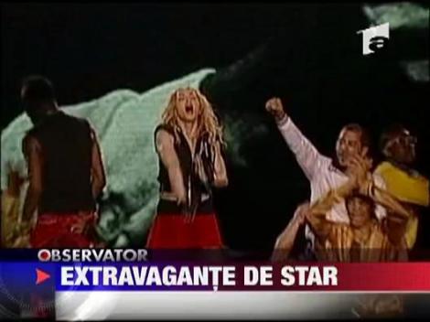 Madonna si-a umplut caloriferele cu apa sfintita