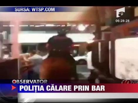 Politia, calare prin bar