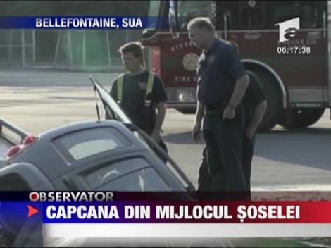 Masina inghitita de sosea in SUA