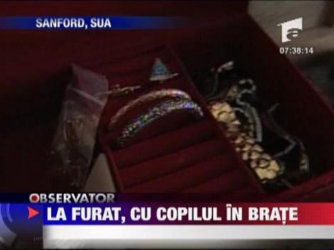 La furat, cu copilul in brate