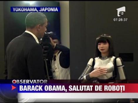 Barack Obama, salutat de roboti