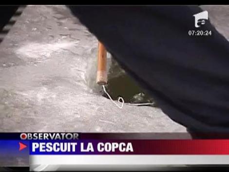 Pasionatii de pescuit la copca