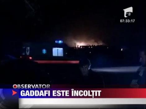 Muammar Gaddafi este incoltit