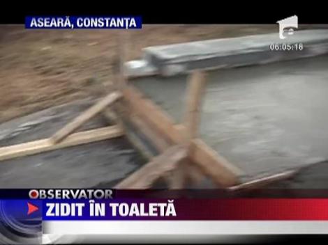 Un om al strazii a fost zidit in toaleta