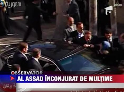 Presedintele Siriei, inconjurat de protestatari