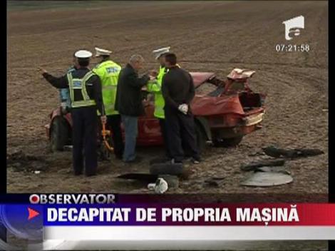 Decapitat in propria masina