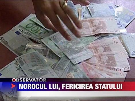 Statul ia 25% din premiul de la loto