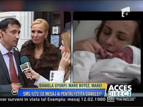 Daniela Gyorfi isi crestineaza fetita