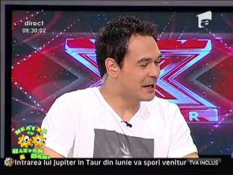 Razvan, surprins de paparazzi, cu degetul in nas