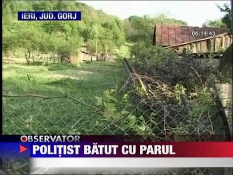 Politist lovit cu un par in cap