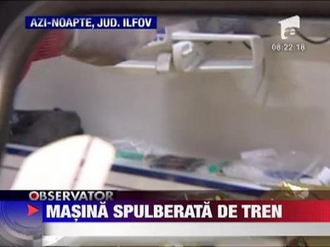 Autoturism spulberat de tren