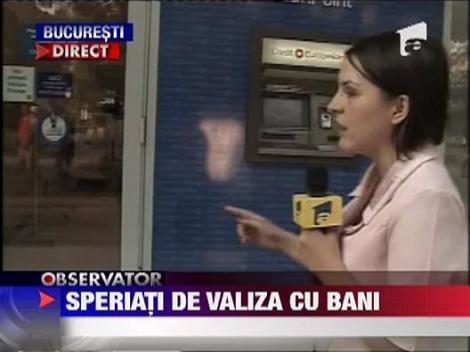 Speriati de o valiza cu bani