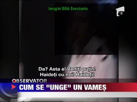 Politist de frontiera filmat in timp ce lua mita