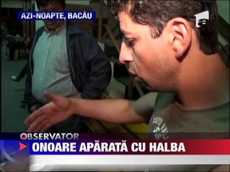 Tanar batut mar cu o halba de bere